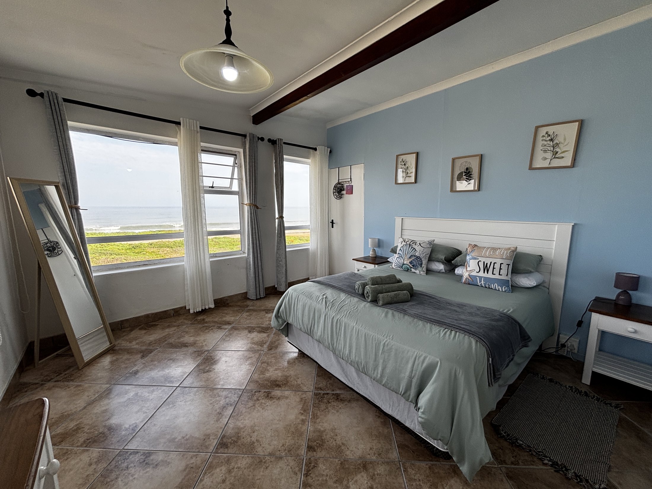 Bedroom with coastal outlook at Seaview Sunsets in Room 1